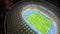 Amazing soccer stadium, glowing night lights, aerial view, sport event building