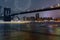 amazing sparkling fireworks Brooklyn Bridge at dusk viewed from New York City.