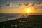 Amazing splash of seawater at sunset on coral rocks.