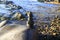 Amazing stack of stones on green moss at seaside beach group of pebble balance on large rock