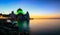 Amazing Straits Mosque of Malacca during sunrise with reflection