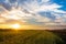 Amazing summer sunset over farmlands in the black dirt region of Pine Island, New York