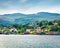 Amazing summer view of typical Norwegian village on the shore of fjord. Stunning morning scene of Norway, Europe. Traveling