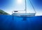 Amazing sunlight seaview to sailboat in tropical sea with deep blue underneath splitted by waterline