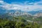 Amazing sunny landscape of white clouds, blue sky, high mountains