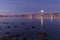 Amazing sunrise with amazing magenta color and moon over Tromso, Norway. Polar night. long shutter speed