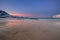 Amazing sunrise with amazing magenta color over sand beach. Tromso, Norway . Polar night. long shutter speed