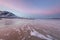 Amazing sunrise with amazing magenta color over sand beach. Tromso, Norway . Polar night. long shutter speed