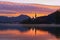 Amazing sunrise on the Lake Bled. Landscape view of island with the Pilgrimage Church of the Assumption of Maria.