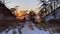 Amazing sunrise on the northern frosty lake. A large winter tent with a stove stands on the shore of the frozen Lake Baikal