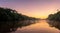 amazing sunrise seen from the amazon river with haze