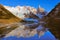 Amazing sunrise view of Cerro Torre mountain by the lake.