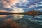 Amazing sunrise view over Danube river, beautiful reflections of morning clouds mirrored in water, Esztergom, Hungary