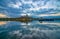 Amazing sunrise view over Danube river, beautiful reflections of morning clouds mirrored in water, Esztergom, Hungary