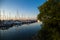 Amazing sunset, boats in the harbor, yachts in a bay of lake at sunset light.