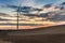 Amazing sunset at countryside with wind turbine in autumn, Poland