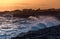 Amazing sunset over sea and cliff. Taranto seafront landscape. W