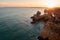 Amazing sunset over unique limestone rocks and secluded beaches near Alvor, Portugal