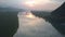 Amazing sunset panorama above wide calm tropical river