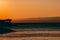 Amazing sunset seascape. Palm trees and orange sky. Brela Croatia, Makarska riviera