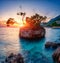Amazing sunset seascape, scenic view of Brela stone, a symbol of Adriatic resort. Travel background, Croatia