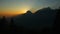 Amazing sunset, sun slowly hiding behind mountain time-lapse