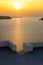 Amazing sunset view from town of Imerovigli to Aegean sea, Santorini island, Thira, Greece