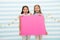 Amazing surprising news. Girl hold announcement banner. Girls kids holding paper banner for announcement. Children happy