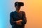 Amazing technology, online game, entertainment, study and virtual world in 3D simulation. Serious millennial man in vr