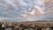 An amazing time lapse of the clouds moving above Santiago city skyline and Andes mountain range. An amazing and colorful scenery