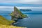 Amazing top view long exposure of Drangarnir gate in front of Tindholmur, Faroe Islands