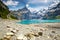 Amazing tourquise Oeschinnensee with waterfalls, wooden chalet and Swiss Alps, Berner Oberland, Switzerland