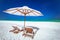 Amazing tropical beach with chairs and umbrella