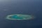 Amazing tropical island at ocean aerial view from seaplane at Maldives