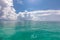 Amazing tropical ocean lagoon bay, coral reef with cloudy sky. Exotic destination seascape