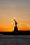 Amazing vertical view of the Statue of Liberty, at sunset