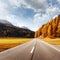 Amazing view of alpine road, orange larch forest and high mountains