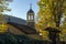 Amazing view Autumn trees and Church of Saint Prophet Elijah in village of Bozhentsi, Bulgaria