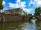 Amazing view of beautiful buildings, bicycles, a bridge with group of people and tourist