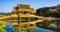 Amazing view of beautiful Golden Bridge and Pavilion of the Enlightened with reflection in the water. Location: Ancient City Park