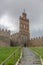 Amazing view at the Carmen entrance door Gate on Ãvila city Walls and fortress, historic landmark, senior man in backs climbing