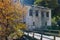 Amazing view of Church of the Assumption, river and Autumn tree in town of Shiroka Laka, Bulgaria