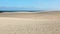 Amazing view of Corralejo sand dunes with blue sea on the background, Fuerteventura Island, Spain