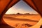 Amazing view of a desert from camping on a tent opening. Generative AI