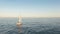 Amazing view from drone of sail yacht sailing in open sea on windy day.