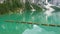 Amazing view of the famous Braies Lake in Italy. Typical rowing boats made of wood. Alpine lake. Iconic location for photographers