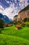 Amazing view of famous Lauterbrunnen town in Swiss Alps valley with beautiful Staubbach waterfalls behind, Switzerland