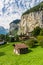 Amazing view of famous Lauterbrunnen town in Swiss Alps valley with beautiful Staubbach waterfalls behind, Switzerland