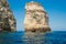 Amazing view of immense rock formations in calm seawater