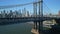 Amazing view of important transport infrastructure, massive steel suspension bridge and iconic Manhattan skyscrapers in